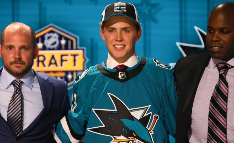 Will Smith tried on a San Jose Sharks sweater after being selected fourth overall. (Bruce Bennett/Getty Images)