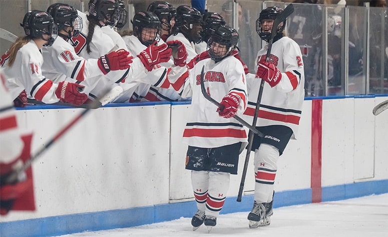 Cadence Crowley (front) celebrates her second goal against Lawrence Academy. (Patrick Donnelly/NEHJ)