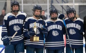 Nobles girls hockey with the Harrington Tournament trophy.
