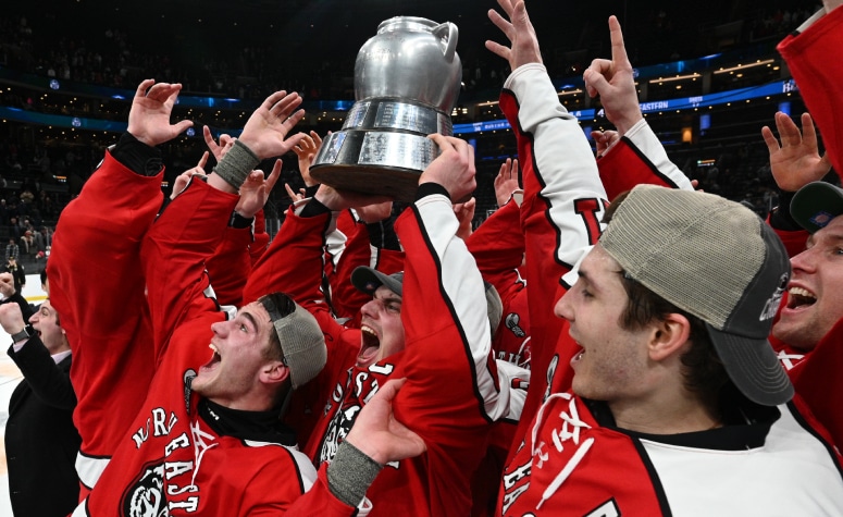 BOSTON, MASSACHUSETTS - FEBRUARY 12: The Northeastern Huskies hold up the 2024 Men's Beanpot Tournament trophy after the game against Boston University at the TD Garden. (Photo by Brian Fluharty/Getty Images)