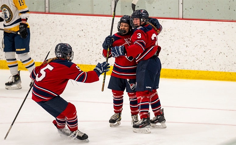 Dexter Southfield celebrates Evelyn Doyle's (3) goal against BB&N last season. (Patrick Donnelly/NEHJ)